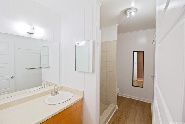 2410 Halenoho Pl, Honolulu, HI 96816 - bathroom featuring vanity, wood finished floors, and tiled shower
