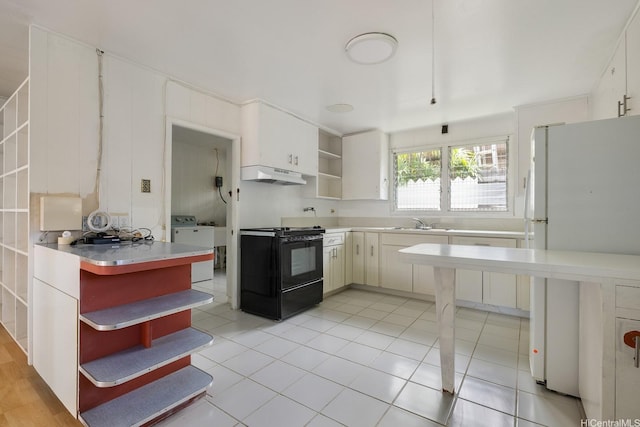 3153 Diamond Head Rd, Honolulu, HI 96815 - kitchen with open shelves, black stove, under cabinet range hood, freestanding refrigerator, and washer / dryer