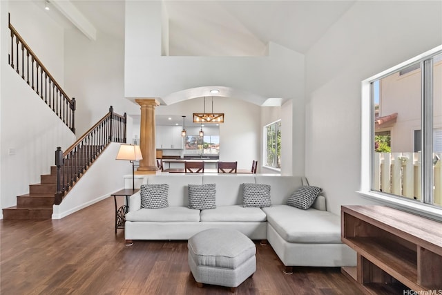 91-1186 Namahoe St, Kapolei, HI 96707 - living room featuring ornate columns, wood finished floors, stairs, and high vaulted ceiling