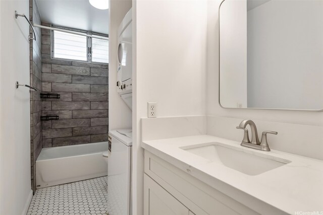 1215 Alexander St Unit 204, Honolulu, HI 96826 - full bath featuring stacked washer / drying machine, vanity, shower / washtub combination, and tile patterned floors