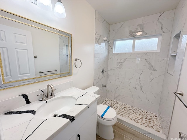 811 20th Ave, Honolulu, HI 96816 - bathroom with a tile shower, vanity, and wood finished floors