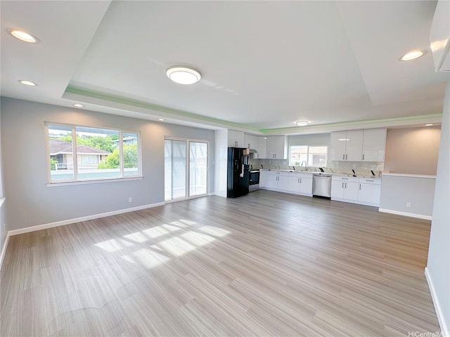 811 20th Ave, Honolulu, HI 96816 - unfurnished living room featuring recessed lighting, light wood-style flooring, and a raised ceiling