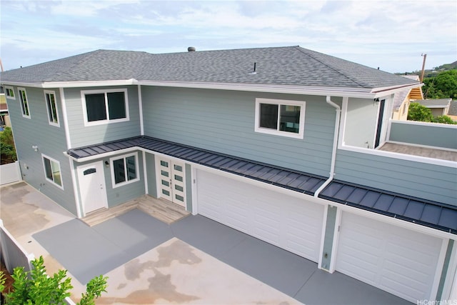 813 20th Ave, Honolulu, HI 96816 - back of property with a standing seam roof, a metal roof, a garage, and a shingled roof