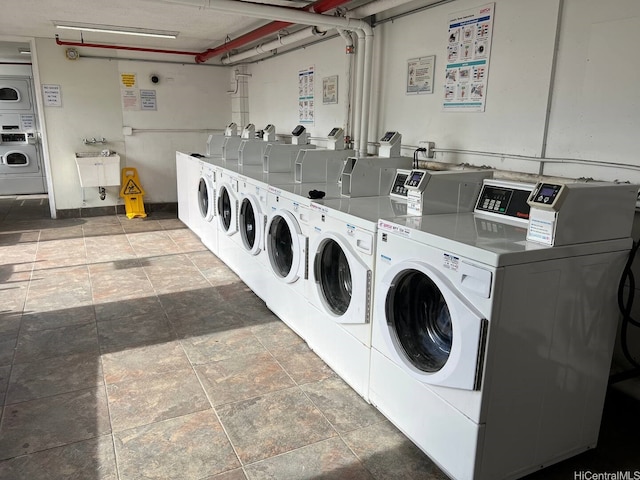 444 Niu St Unit 2906, Honolulu, HI 96815 - shared laundry room featuring washer and dryer, stone finish floors, and stacked washer and clothes dryer