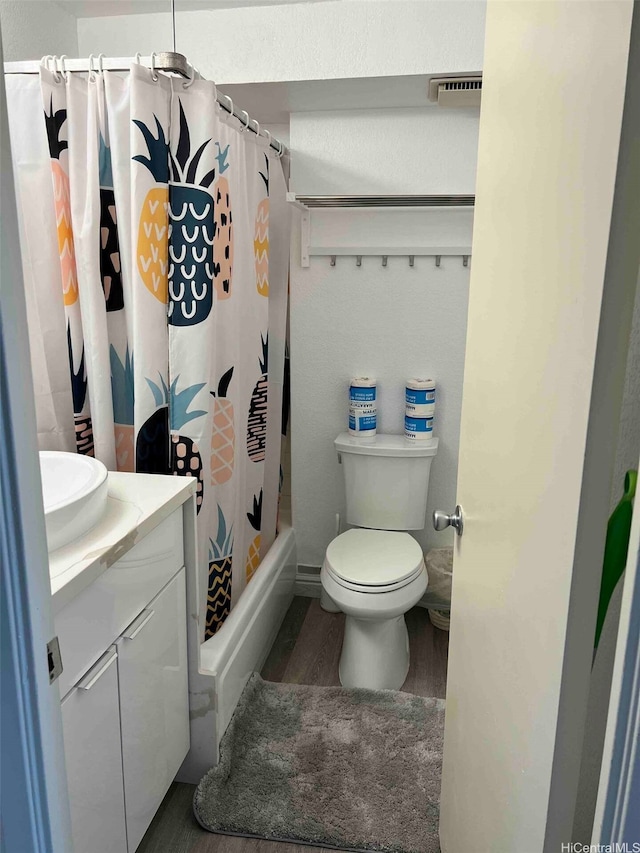 444 Niu St Unit 2906, Honolulu, HI 96815 - full bathroom with wood finished floors, vanity, and shower / bath combo with shower curtain