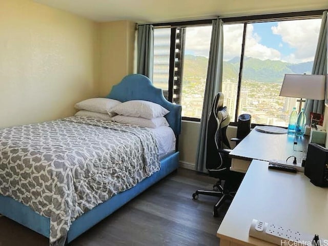 444 Niu St Unit 2906, Honolulu, HI 96815 - bedroom featuring wood finished floors, a desk, and a mountain view