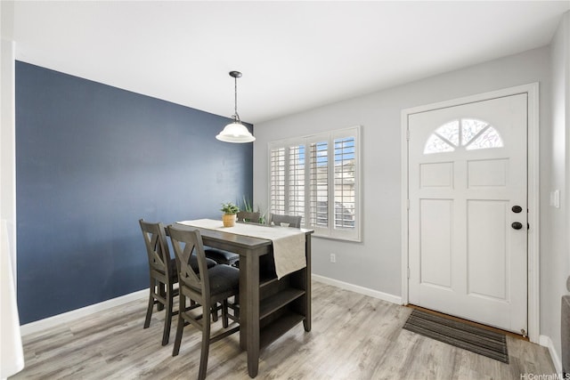 91-1031 Kaimalie St Unit 4M4, Ewa Beach, HI 96706 - dining space with light wood-type flooring and baseboards