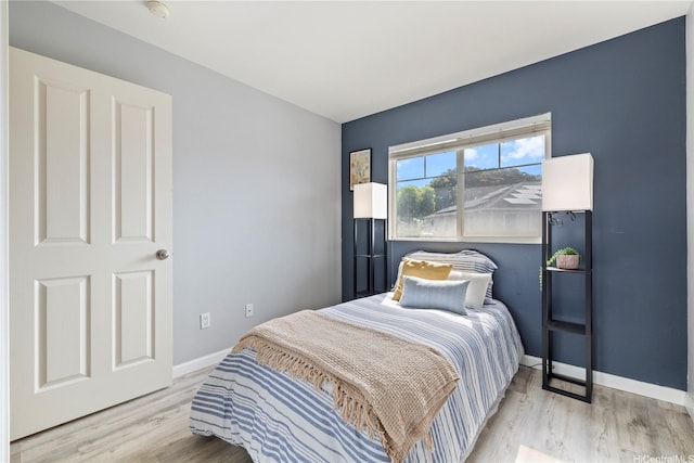 91-1031 Kaimalie St Unit 4M4, Ewa Beach, HI 96706 - bedroom with light wood finished floors