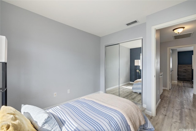 91-1031 Kaimalie St Unit 4M4, Ewa Beach, HI 96706 - bedroom featuring light wood-style floors and a closet
