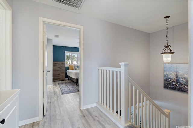 91-1031 Kaimalie St Unit 4M4, Ewa Beach, HI 96706 - corridor with an upstairs landing and light wood finished floors