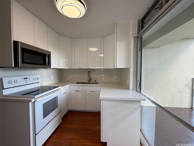 1519 Nuuanu Ave Unit 1146, Honolulu, HI 96817 - kitchen featuring white range with electric cooktop, stainless steel microwave, white cabinets, and light countertops