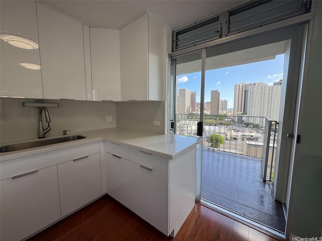 1519 Nuuanu Ave Unit 1146, Honolulu, HI 96817 - kitchen with dark wood-type flooring, white cabinetry, and light countertops
