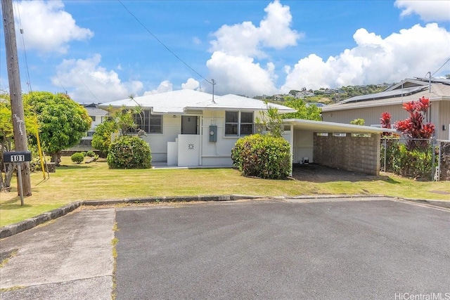 101 Kawananakoa Pl, Honolulu, HI 96817 - view of front facade featuring a front yard, a carport, and driveway