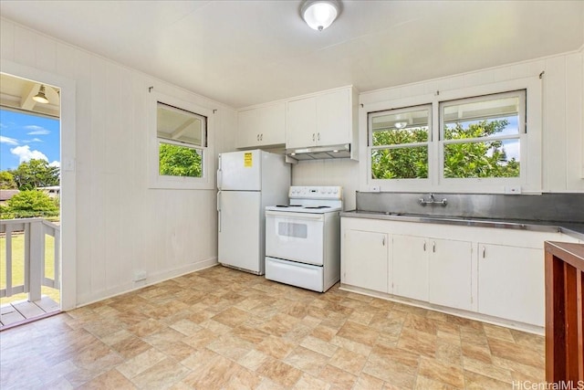 101 Kawananakoa Pl, Honolulu, HI 96817 - kitchen featuring white appliances, under cabinet range hood, stone finish flooring, and plenty of natural light