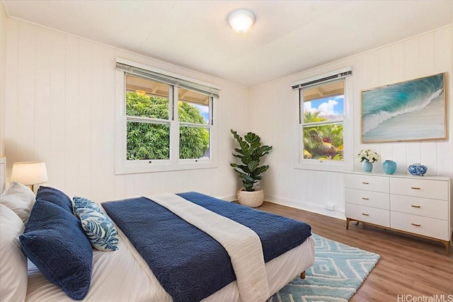 101 Kawananakoa Pl, Honolulu, HI 96817 - bedroom featuring wood finished floors and wood walls