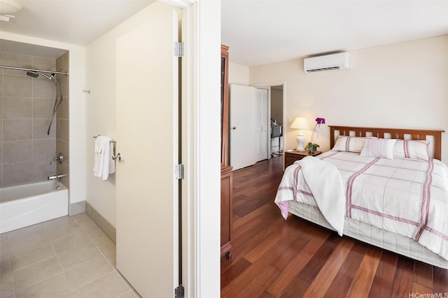 909 Kapiolani Blvd Unit 2002, Honolulu, HI 96814 - bedroom featuring a wall mounted AC and wood finished floors