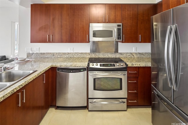 909 Kapiolani Blvd Unit 2002, Honolulu, HI 96814 - kitchen featuring appliances with stainless steel finishes, light tile patterned flooring, and light stone counters