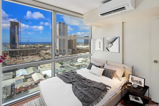 909 Kapiolani Blvd Unit 2002, Honolulu, HI 96814 - bedroom featuring a wall unit AC, a view of city, and a wall of windows