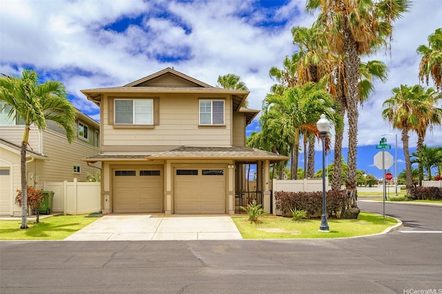 91-1200 Keaunui Dr Unit 208, Ewa Beach, HI 96706 - view of front facade featuring a garage, driveway, and roof with shingles
