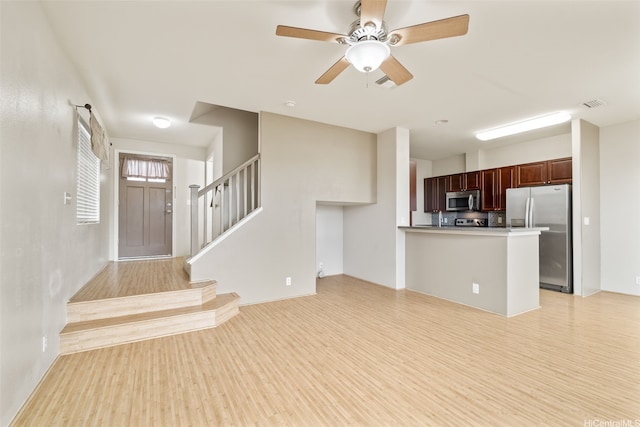 91-1200 Keaunui Dr Unit 208, Ewa Beach, HI 96706 - kitchen with stainless steel appliances, light wood-type flooring, a peninsula, and ceiling fan