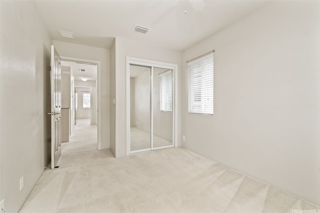 91-1200 Keaunui Dr Unit 208, Ewa Beach, HI 96706 - unfurnished bedroom featuring light colored carpet, a closet, and ceiling fan