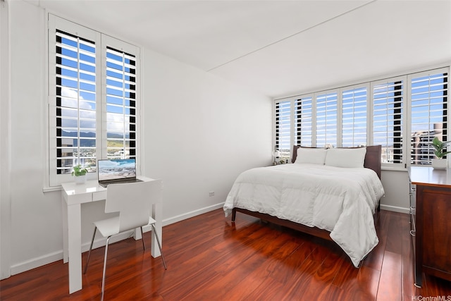 411 Hobron Ln Unit 3801, Honolulu, HI 96815 - bedroom featuring multiple windows and wood finished floors