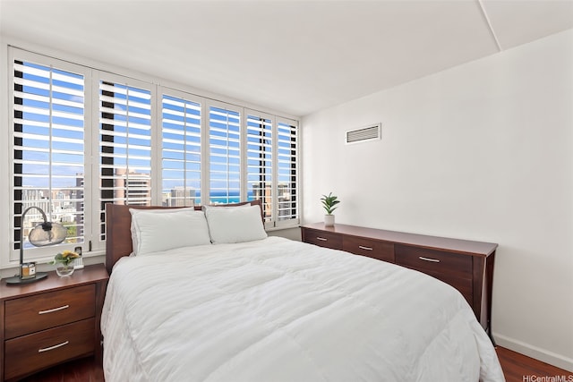 411 Hobron Ln Unit 3801, Honolulu, HI 96815 - bedroom with wood finished floors and baseboards