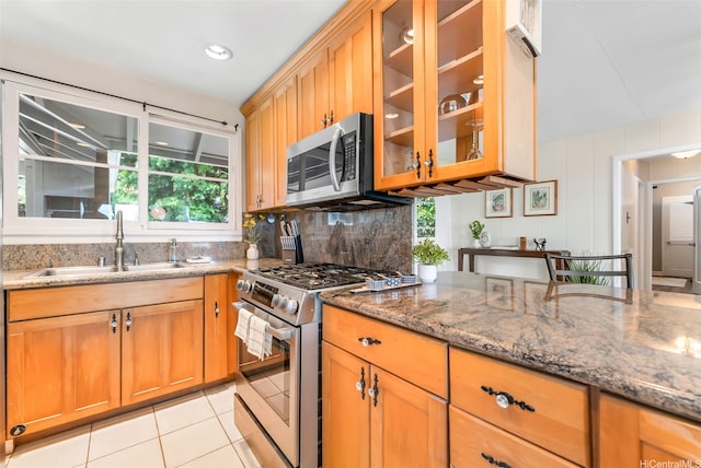 4845 Sierra Dr, Honolulu, HI 96816 - kitchen featuring stainless steel appliances, stone counters, glass insert cabinets, and light tile patterned floors