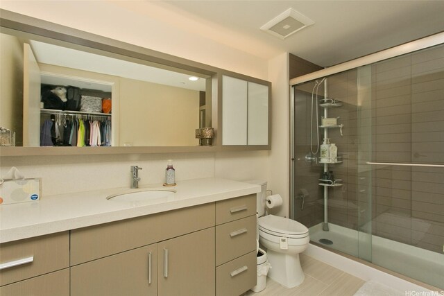 600 Ala Moana Blvd Unit 3401, Honolulu, HI 96813 - full bath featuring vanity, a stall shower, a walk in closet, and tile patterned flooring