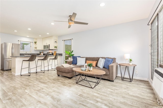 47-366 Hui Iwa St Unit 71, Kaneohe, HI 96744 - living room with light wood-type flooring, ceiling fan, and recessed lighting