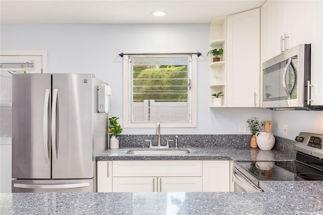 47-366 Hui Iwa St Unit 71, Kaneohe, HI 96744 - kitchen featuring stainless steel appliances, dark stone counters, open shelves, and recessed lighting