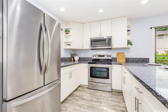 47-366 Hui Iwa St Unit 71, Kaneohe, HI 96744 - kitchen with appliances with stainless steel finishes, open shelves, white cabinetry, recessed lighting, and light wood finished floors