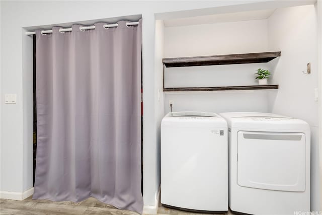 47-366 Hui Iwa St Unit 71, Kaneohe, HI 96744 - washroom featuring independent washer and dryer and light wood-style flooring