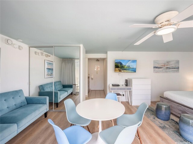 2427 Kuhio Ave Unit 1501, Honolulu, HI 96815 - dining room with wood finished floors and ceiling fan
