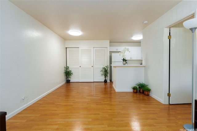 239 Mananai Pl Unit 54F, Honolulu, HI 96818 - entryway with light wood-style floors and baseboards
