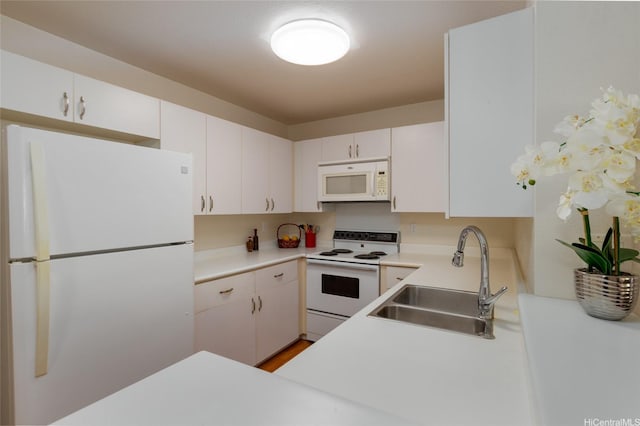 239 Mananai Pl Unit 54F, Honolulu, HI 96818 - kitchen with white appliances, light countertops, and white cabinets