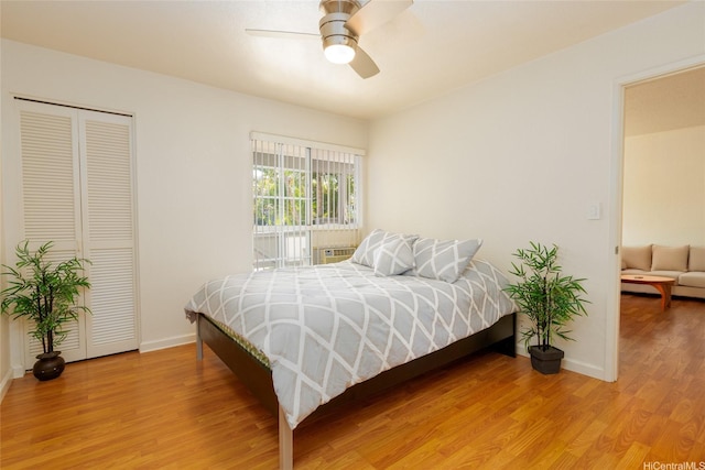 239 Mananai Pl Unit 54F, Honolulu, HI 96818 - bedroom with light wood-style floors, a closet, and ceiling fan
