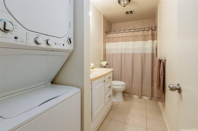 239 Mananai Pl Unit 54F, Honolulu, HI 96818 - bathroom featuring stacked washer and clothes dryer, vanity, tile patterned flooring, and a shower with curtain