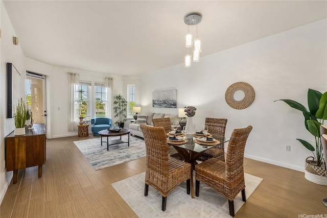 520 Lunalilo Home Rd Unit 6107, Honolulu, HI 96825 - dining room with baseboards and wood finished floors