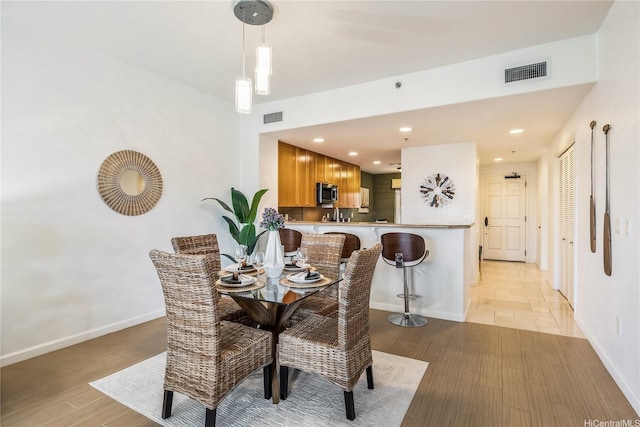 520 Lunalilo Home Rd Unit 6107, Honolulu, HI 96825 - dining room with baseboards and light wood-type flooring