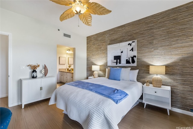 520 Lunalilo Home Rd Unit 6107, Honolulu, HI 96825 - bedroom with wood finished floors, tile walls, a ceiling fan, and ensuite bath