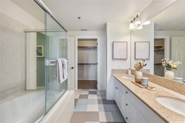 520 Lunalilo Home Rd Unit 6107, Honolulu, HI 96825 - full bathroom with double vanity, a shower with shower door, a spacious closet, and tiled tub