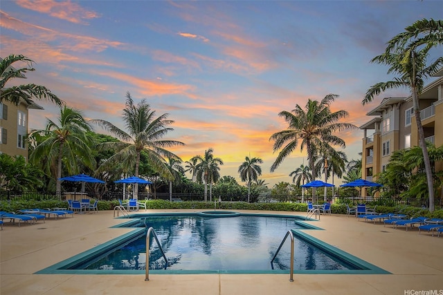 520 Lunalilo Home Rd Unit 6107, Honolulu, HI 96825 - pool at dusk with a community pool and a patio area