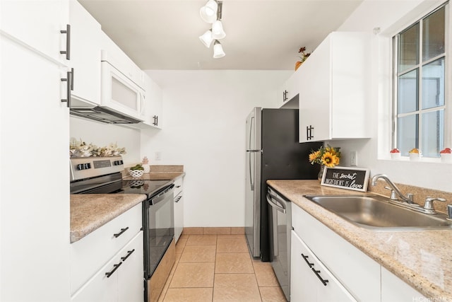 94-1465 Waipio Uka St Unit S103, Waipahu, HI 96797 - kitchen featuring stainless steel appliances, white cabinetry, light countertops, and light tile patterned floors