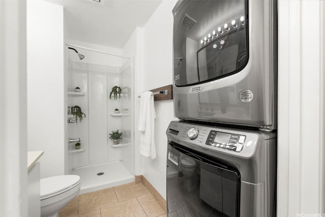 94-1465 Waipio Uka St Unit S103, Waipahu, HI 96797 - bathroom featuring stacked washer / dryer, a walk in shower, tile patterned flooring, and vanity