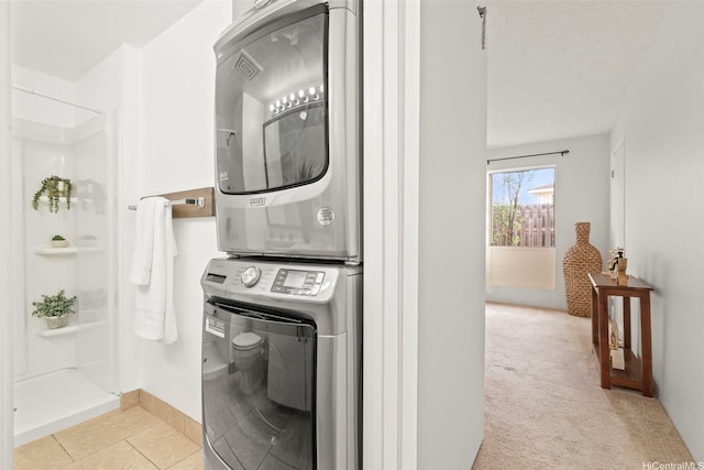 94-1465 Waipio Uka St Unit S103, Waipahu, HI 96797 - laundry area with stacked washer / drying machine, light tile patterned flooring, and light carpet