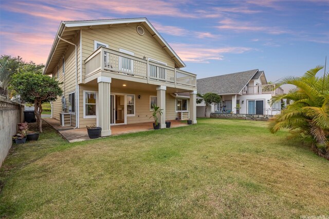 94-547 Lumiauau St, Waipahu, HI 96797 - back of property at dusk with a balcony and a patio