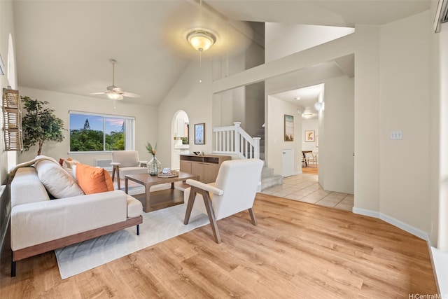 94-547 Lumiauau St, Waipahu, HI 96797 - living area featuring ceiling fan, light wood finished floors, stairway, and high vaulted ceiling