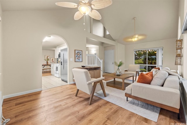 94-547 Lumiauau St, Waipahu, HI 96797 - living area featuring a ceiling fan, high vaulted ceiling, stairway, light wood finished floors, and arched walkways