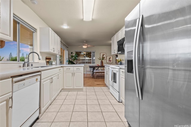 94-547 Lumiauau St, Waipahu, HI 96797 - kitchen with stainless steel appliances, a ceiling fan, white cabinets, and light countertops